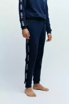 Спортивные штаны HUGO Underwear "Sporty Logo Pant" с надписью HUGO по всей поверхности, синий
