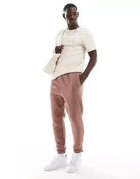 Спортивные штаны с этикеткой в коричневом цвете Hera