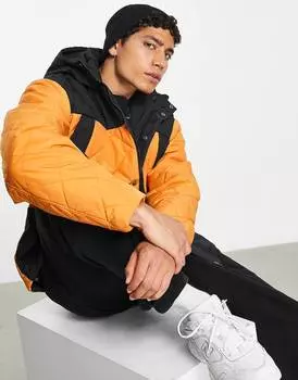 Стеганый дождевик оверсайз с капюшоном ASOS DESIGN в оранжево-черных тонах