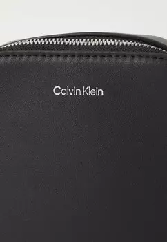 Сумка через плечо SLEEK REPORTER Calvin Klein, черный