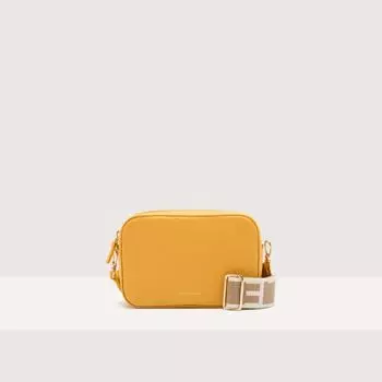Сумка кросс-боди Coccinelle Tebe Small, цвет Soleado