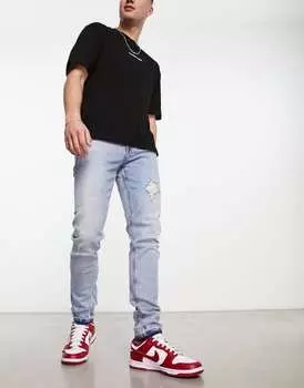 Светло-голубые джинсы скинни с рваными краями ASOS DESIGN