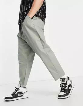 Светло-зеленые брюки чинос с заниженным шаговым швом ASOS DESIGN