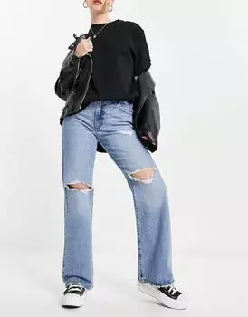 Светлые расклешенные джинсы Levi's с прорезями на коленях