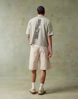 Свободное поло с короткими рукавами и вышивкой зеленого цвета от ASOS DESIGN