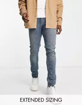 Темно-синие джинсы скинни с отливом ASOS DESIGN