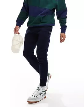 Темно-синие узкие спортивные брюки с логотипом Lacoste