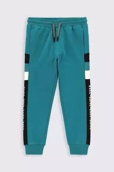 Тренировочные брюки Coccodrillo бирюзовый с карманами и вставками из других материалов