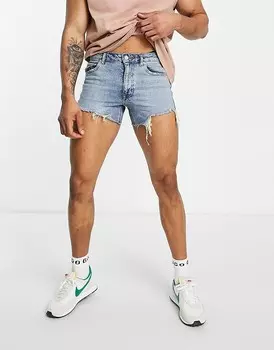 Укороченные джинсовые шорты ASOS DESIGN в стиле 90-х с рваными деталями и необработанным краем по краю