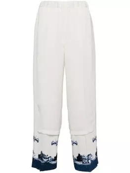 Undercover брюки с графическим принтом и вставками, белый