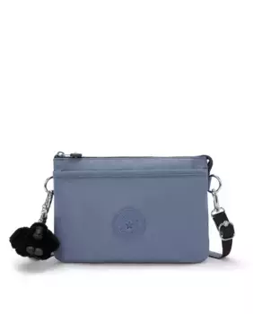 Универсальная женская сумка через плечо Kipling синего цвета с удлиняющимся ремешком