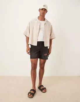 Узкие джинсовые шорты средней длины с разрывами ASOS DESIGN черного цвета