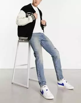 Узкие зауженные джинсы Levi's 512 в винтажном синем цвете с потертостями на коленях