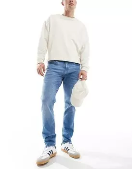 Узкие зауженные джинсы синего цвета Tommy Jeans