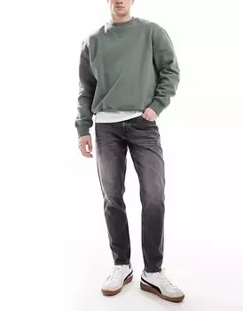 Зауженные джинсы ASOS DESIGN эластичного кроя в винтажном черном цвете