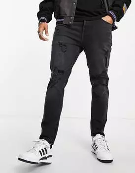 Зауженные джинсы черного цвета с крупными прорезями ASOS DESIGN