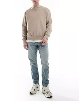Зауженные джинсы светло-голубого цвета ASOS DESIGN