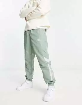 Зеленые спортивные брюки из плетеной ткани adidas Originals Rekive Cut & Sew