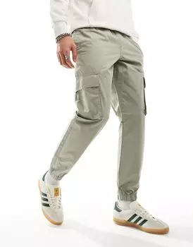 Зеленые зауженные брюки ASOS DESIGN