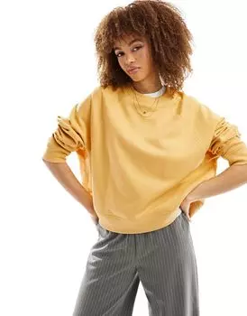 Желтый свободный свитшот ASOS DESIGN с деталями реглан