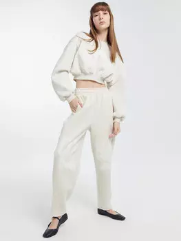 Брюки женские бананы в бежевом цвете с печатью