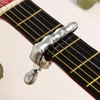 Каподастр для гитары