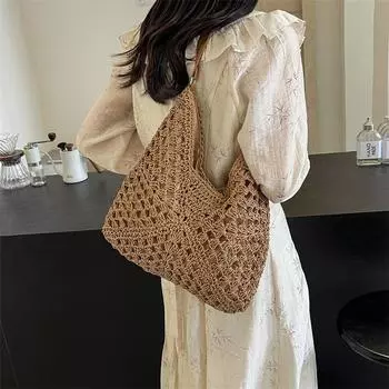 2024 Новинка высокого класса, элегантный и отпускной стиль, маленькая и популярная полая плетеная, модная и модная женская сумка на одно плечо из травяной ткани