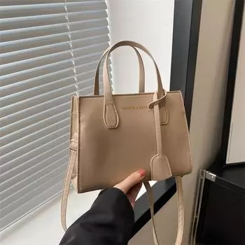 2024 новый темпераментный модный дизайн иностранный стиль однотонный большой вместимости застежка-молния текстура портативная сумка через плечо чёрный