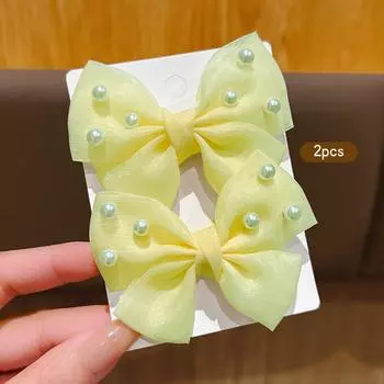 2 cute yellow bow hair clips and hair accessories suitable for daily use