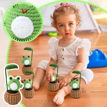 A Knitted Small Doll Potted Plant Toy Is A Doll Made By Crochet Yarn One Size