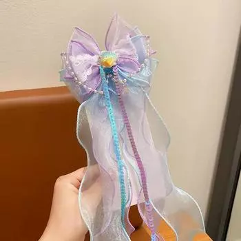 A mermaid princess bow hair clip with a floating gauze pair for a birthday performance hair accessory and veil Size fits all