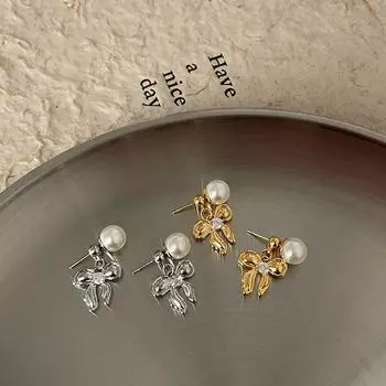A Pair Of Zircon Bow Pearl Stud Earrings For Women S Light Luxury, High-End Elegance, Personality And Versatile Temperament Earrings And Earrings.