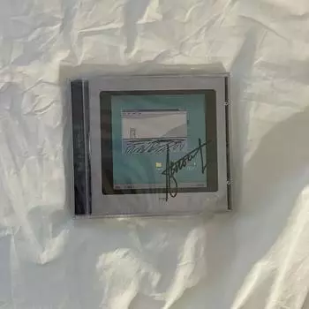 Ан Бён-Вун, сидящий в блюдце, нераспечатанный автограф-альбом на CD