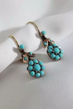 Аутентичная серьга с фигуркой цветка из голубого камня