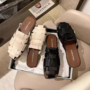 Baotou slippers women s outer wear 2025 summer new retro beach flat-bottomed woven sandals versatile lazy muller shoes 35