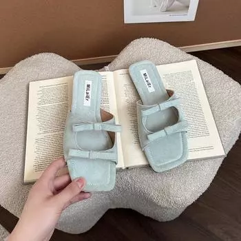 Bow hollow flat bottom sandals women wear new square head beach one-word slippers in summer 35