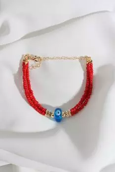 Браслет из красных бусин с бусинкой от сглаза