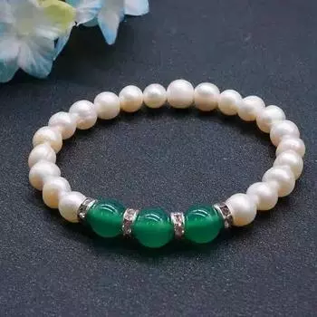 Браслет из оникса с бусинами-ракушками