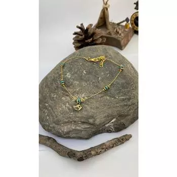 Браслет ручной работы в виде фигуры птицы