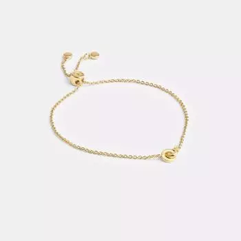Браслет-слайдер Coach Interlocking золотистый