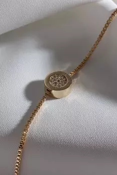 Браслет золотого цвета с белым цирконом и круглой полоской