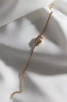 Браслет золотого цвета с фигуркой слона из циркона