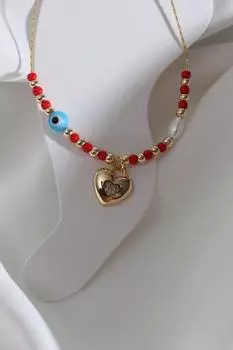 Браслет золотого цвета с подвеской в виде сердца из камня и циркона