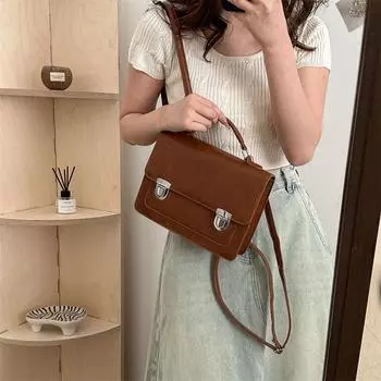 Британский стиль ретро простой женский рюкзак 2024 весна новый популярный модный текстурный портативный рюкзак через плечо чёрный