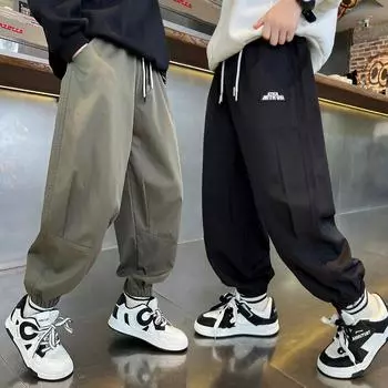 Брюки для мальчиков 2024 года, весна и осень, новые брюки для детей среднего и старшего возраста, свободные детские спортивные брюки для мальчиков, повседневные, универсальные, черного цвета 120cm чёрный