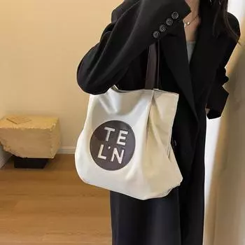 Casual niche premium sense bag women s summer 2024 new Korean version canvas bag large capacity tote commuter shoulder bag хаки