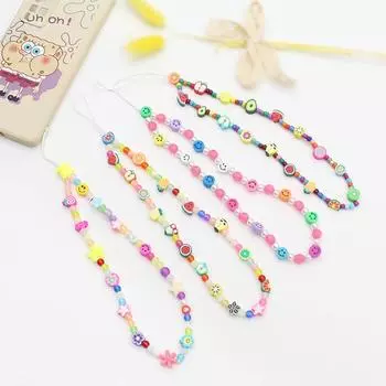 Цепочка для мобильного телефона с разноцветными мультяшными фруктами, улыбающимися лицами, мягкими керамическими бусинами в виде букв, предотвращающими зависание мобильного телефона на цепочке.
