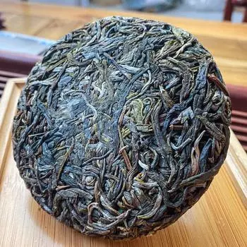 Чай пуэр из Юньнаня 100 г - сырой чай Си Гуй с ароматом орхидеи