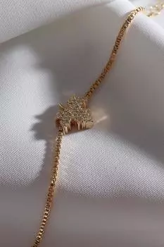 Четырехлистный клевер небольшого размера золотого цвета с камнем циркона