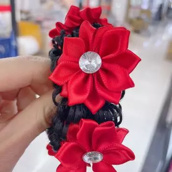 Children s festive hair accessory, a large red flower hairband for kids, suitable for celebratory updo hairstyles.